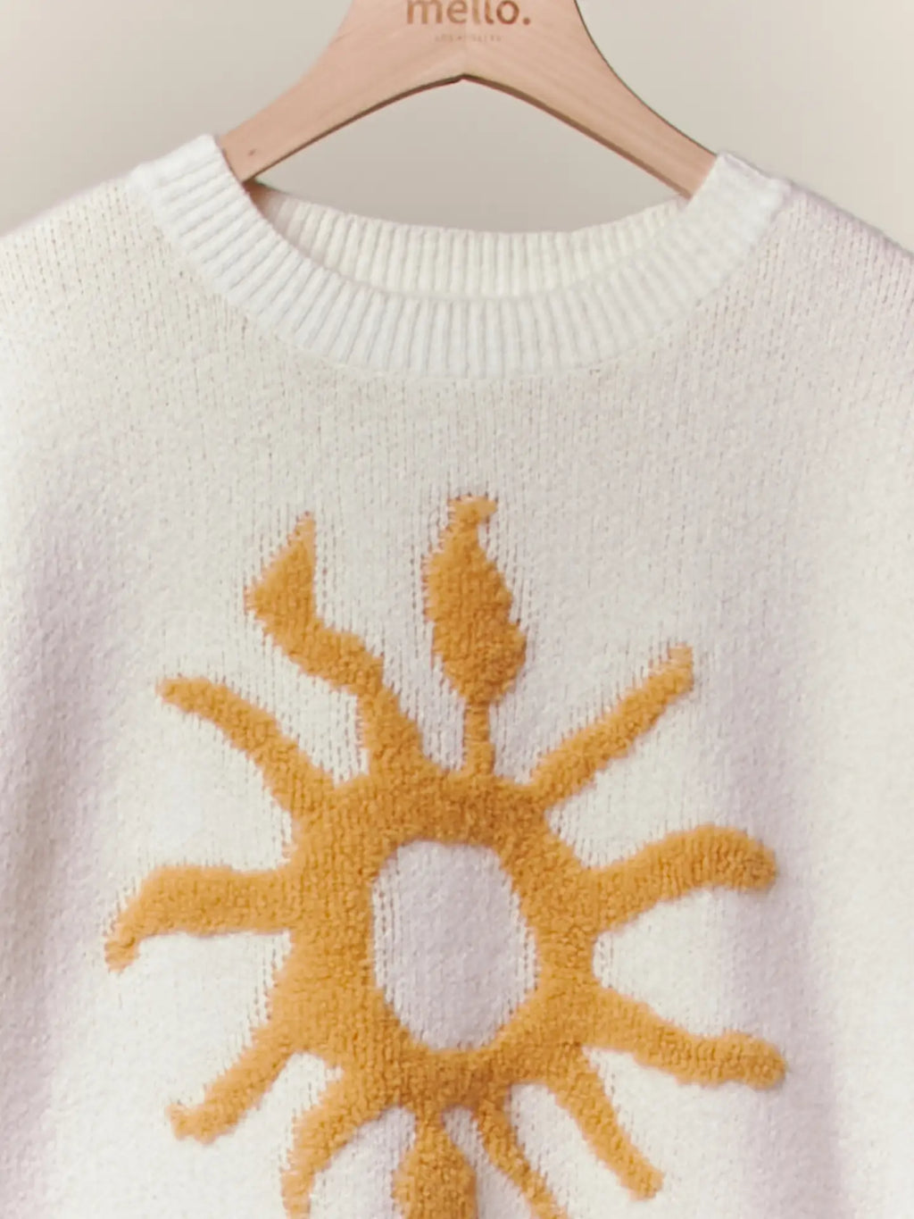 Cozy Knit Sweater with Bold Yellow Sun Patch