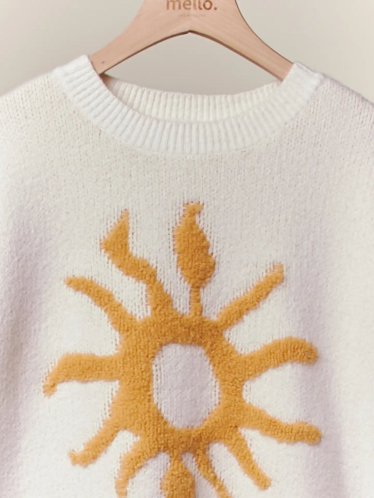 Cozy Knit Sweater with Bold Yellow Sun Patch